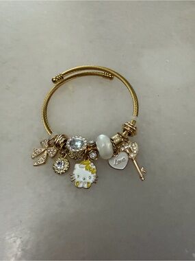 Gold-Tone Hello Kitty Charm Bracelet with Key and Crystal Accents